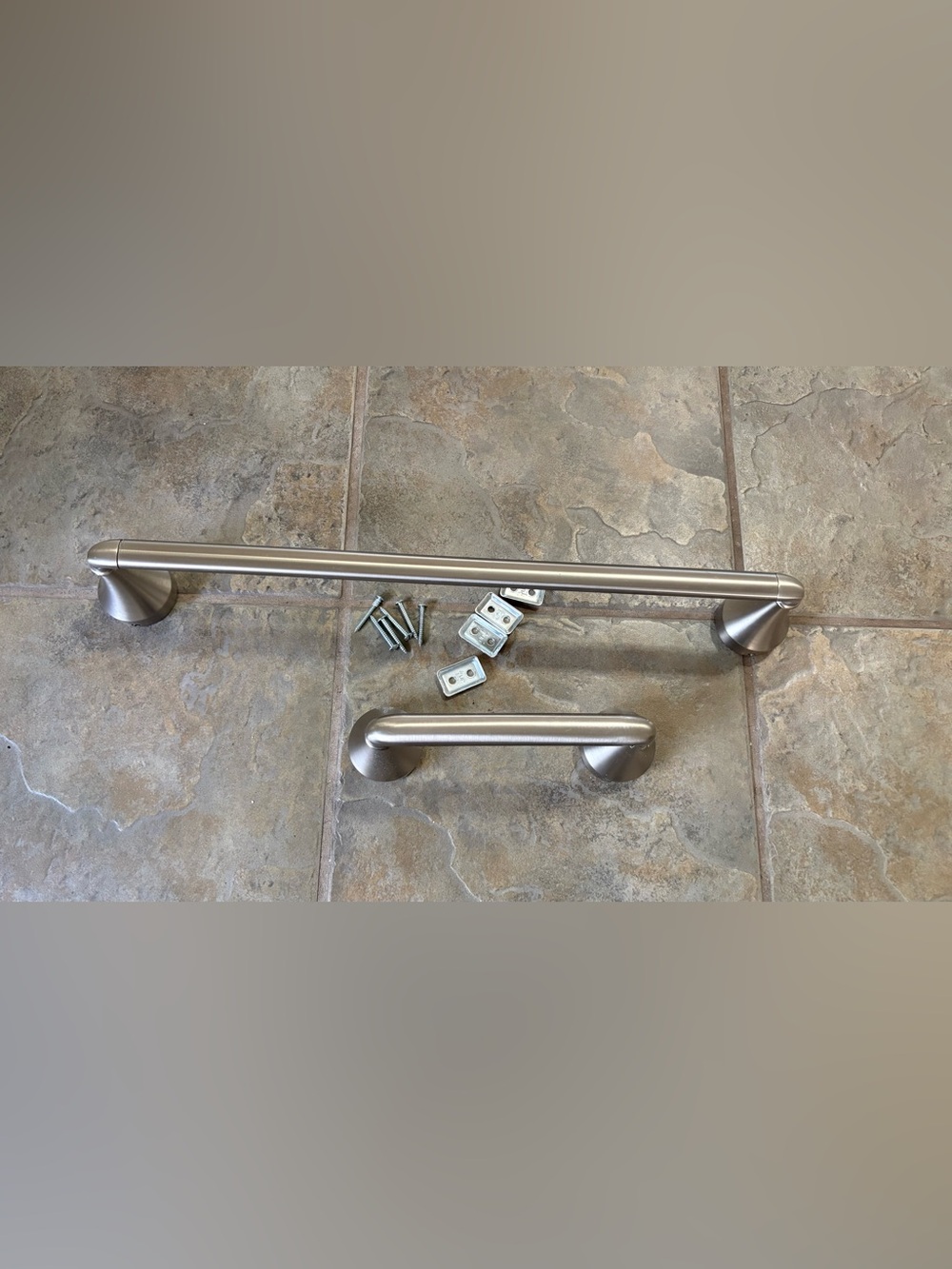 Towel bar and matching toilet paper bar, brushed nickel.